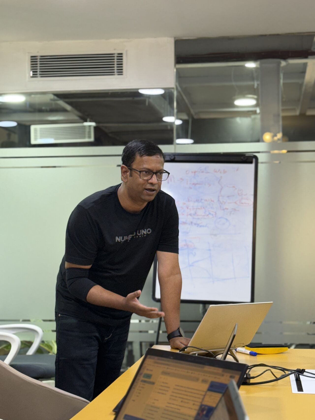 Senior consultant presenting at a flipchart